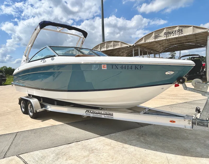 Slide: The Image of 2022 Cobalt R4 Outboard on trailer, blue sky. - 3