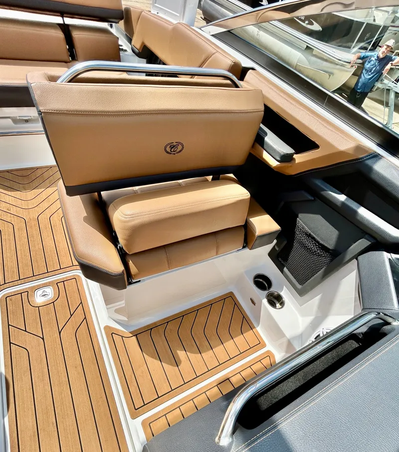 Slide: The Image of Interior of a 2022 Cobalt R4 Outboard with brown leather seats. - 30