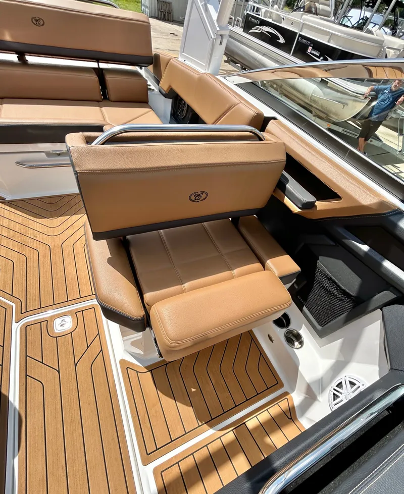 Slide: The Image of Interior of a 2022 Cobalt R4 Outboard with brown leather seats. - 31