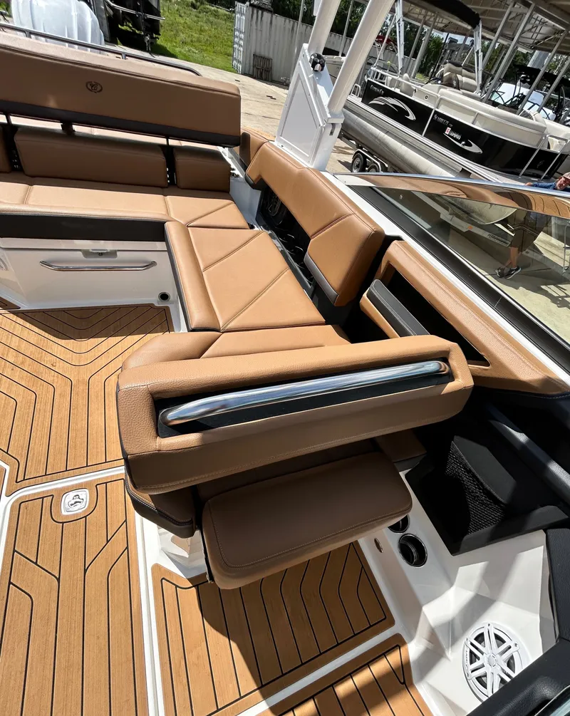 Slide: The Image of Interior of 2022 Cobalt R4 Outboard with brown leather seating. - 34