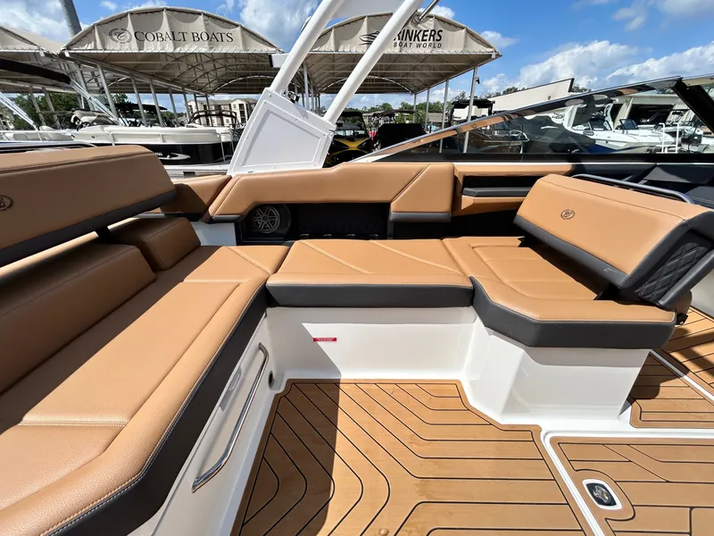 Slide: The Image of Interior of 2022 Cobalt R4 Outboard with brown leather seating. - 39