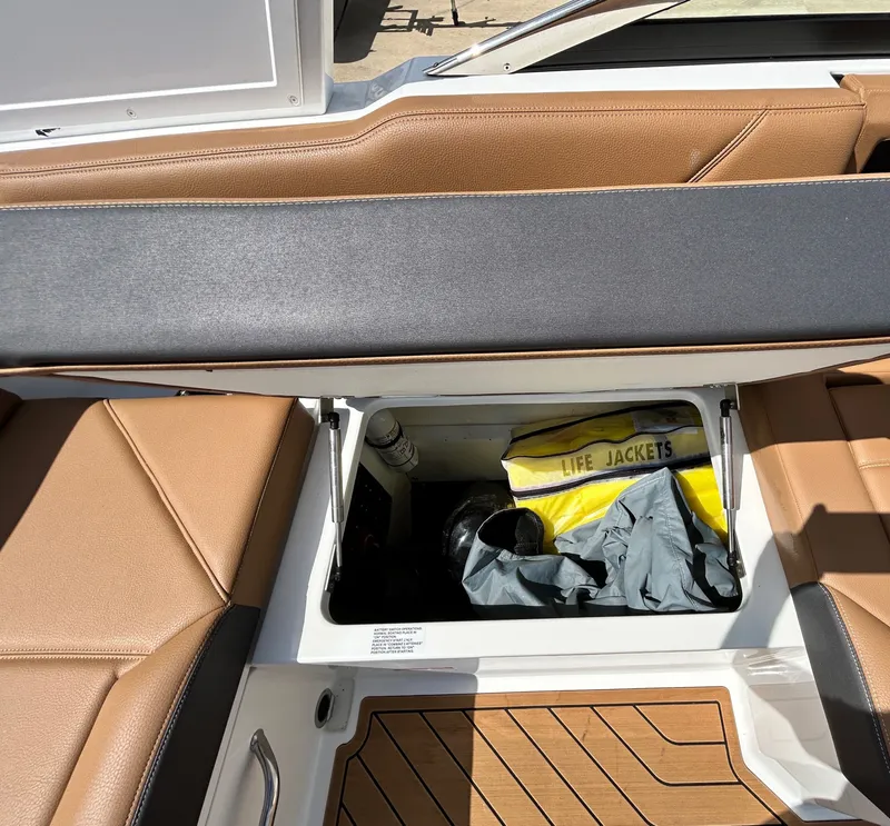 Slide: The Image of Cobalt R4 Outboard 2022 boat with storage and life jackets. - 41