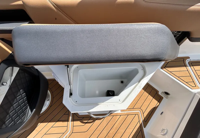 Slide: The Image of Cobalt R4 Outboard 2022, bench seat with storage on wooden deck. - 45