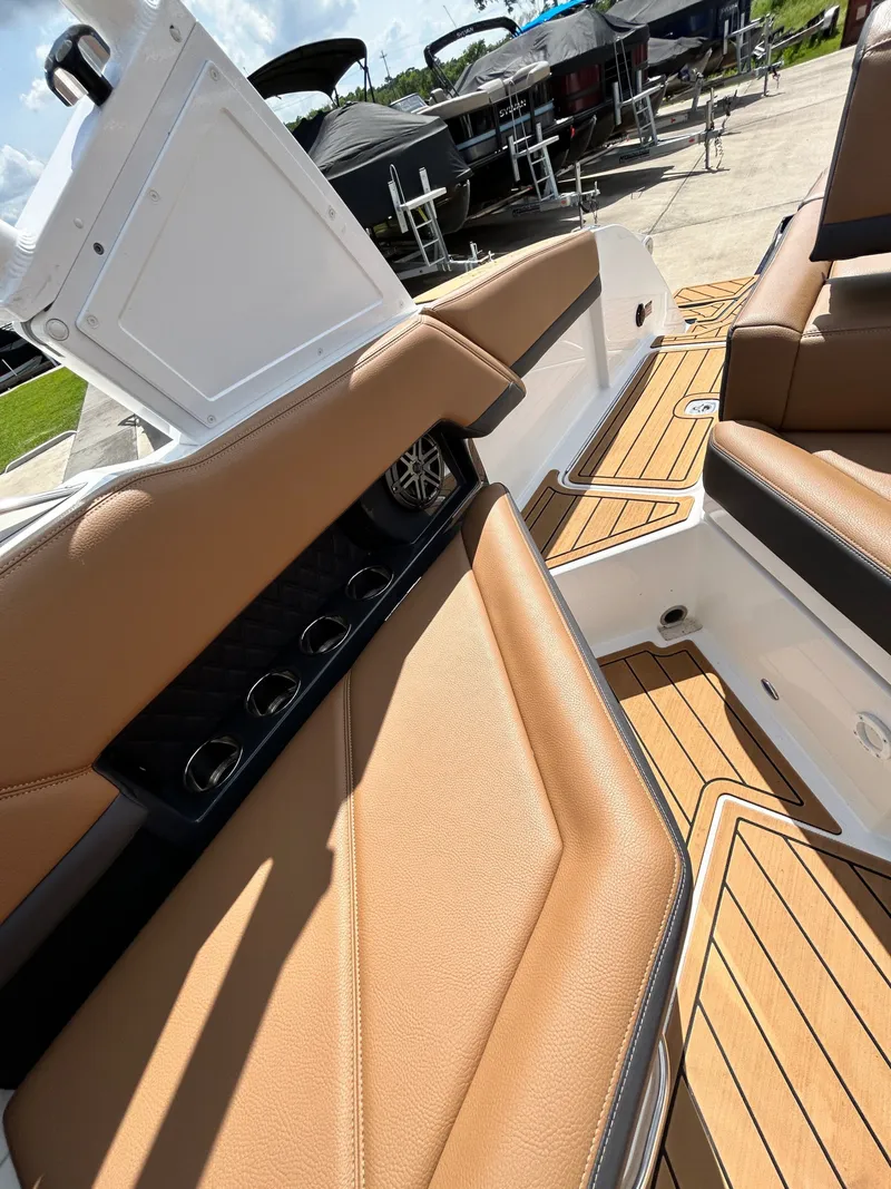 Slide: The Image of Interior of 2022 Cobalt R4 Outboard with brown leather seating. - 46