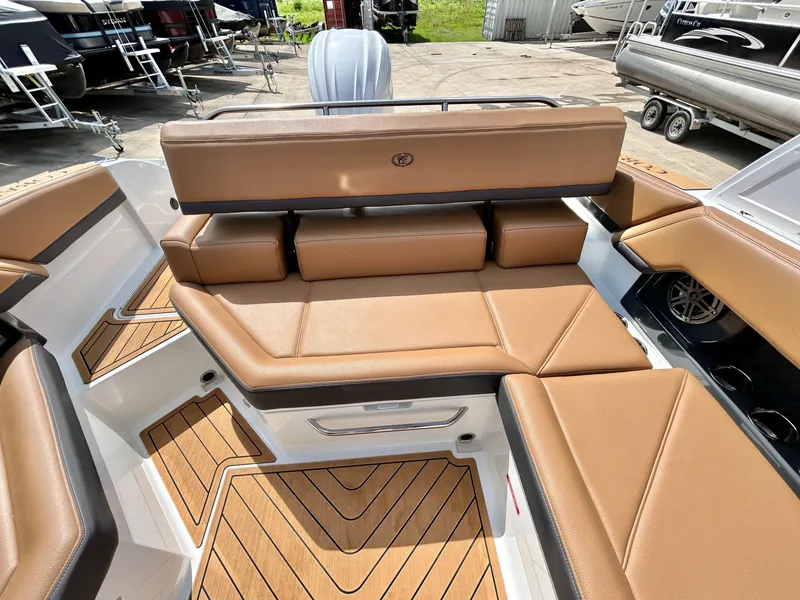 Slide: The Image of Interior of 2022 Cobalt R4 Outboard with brown leather seating. - 47