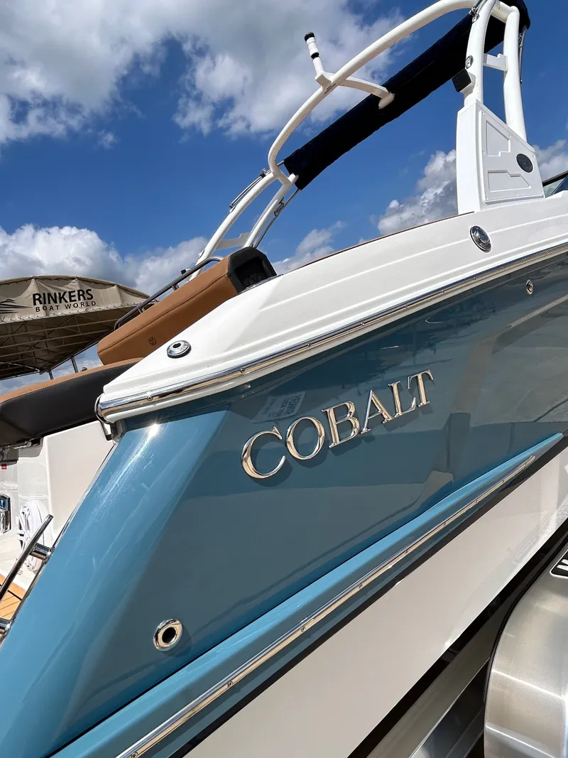 Slide: The Image of 2022 Cobalt R4 Outboard boat with blue hull and clear sky. - 6