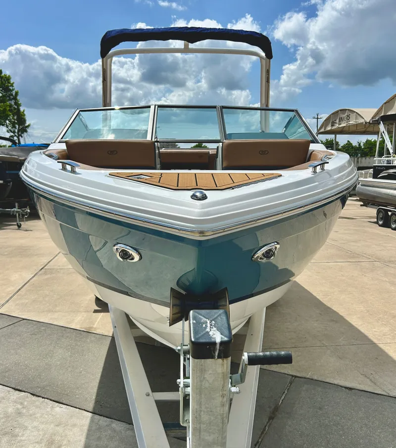 Slide: The Image of 2022 Cobalt R4 Outboard boat on trailer, blue sky. - 7
