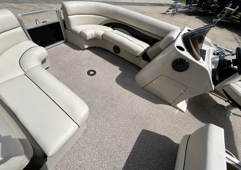Slide: The Image of Interior of a 2012 Cypress Cay SEABREEZE 23 pontoon boat with beige seating. - 15