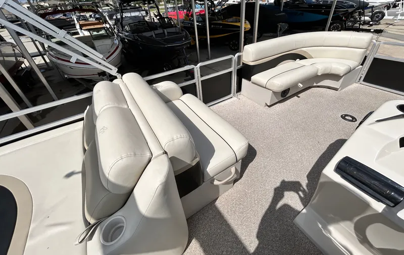 Slide: The Image of Interior of a 2012 Cypress Cay SEABREEZE 23 pontoon boat with beige seating. - 25