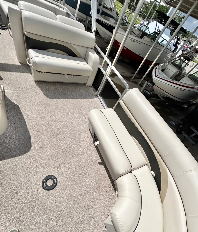 Slide: The Image of Interior of a 2012 Cypress Cay SEABREEZE 23 pontoon boat with beige seating. - 26