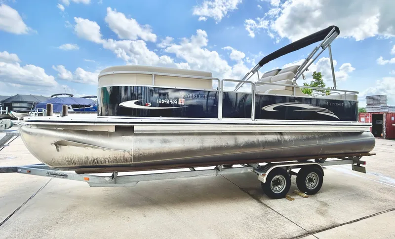 Slide: The Image of 2012 Cypress Cay SEABREEZE 23 pontoon boat on trailer under blue sky. - 3