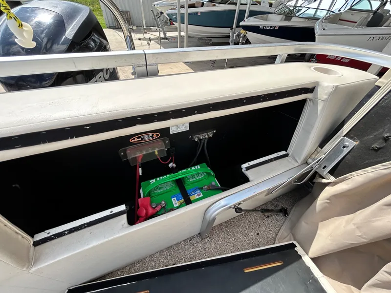 Slide: The Image of 2012 Cypress Cay SEABREEZE 23 boat with open storage compartment and battery. - 39