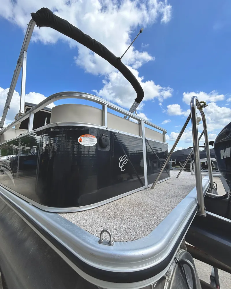 Slide: The Image of 2012 Cypress Cay SEABREEZE 23 pontoon boat under blue sky. - 9