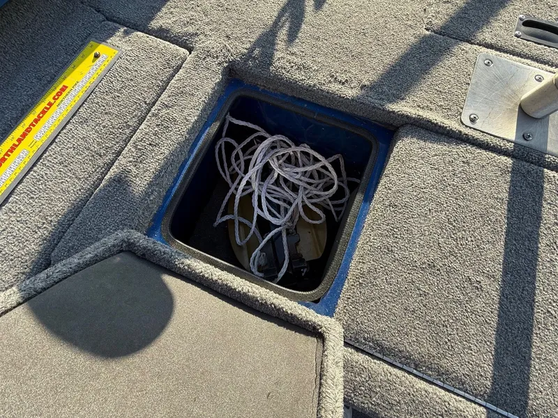 Slide: The Image of Storage compartment in 2009 Alumacraft Pro 175 boat with rope. - 13
