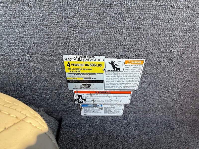 Slide: The Image of Safety and capacity labels on Alumacraft Pro 175 boat. - 23