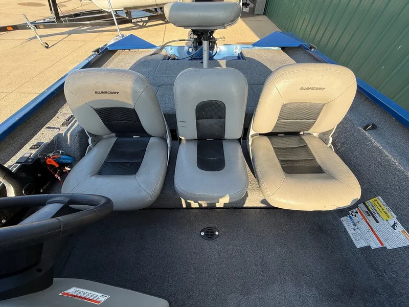 Slide: The Image of Interior of a 2009 Alumacraft Pro 175 with three seats. - 24