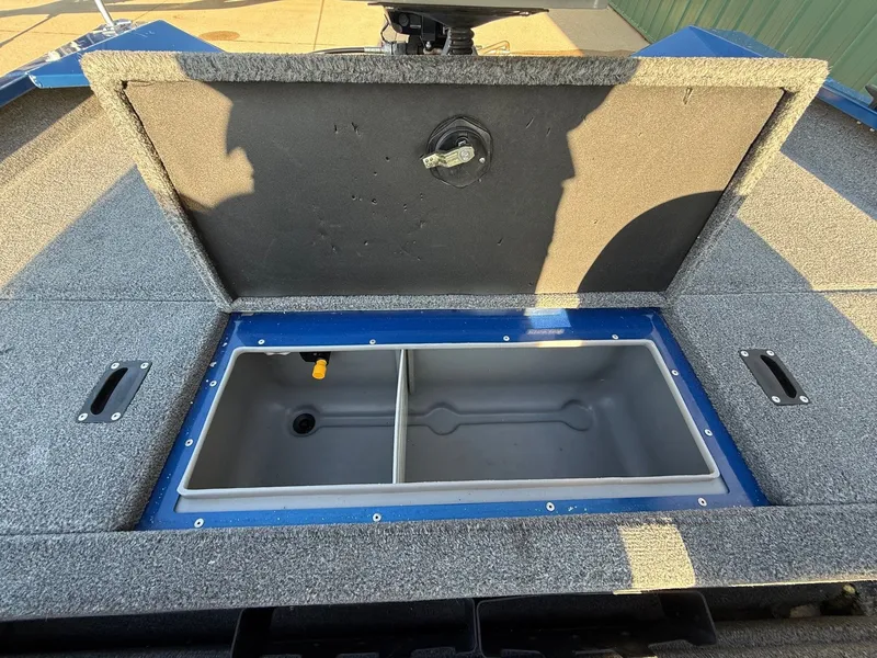 Slide: The Image of 2009 Alumacraft Pro 175 boat with open storage compartment. - 25