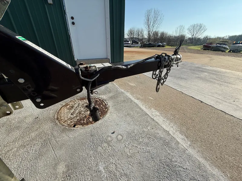 Slide: The Image of Trailer hitch of a 2009 Alumacraft Pro 175 boat on parking lot. - 31