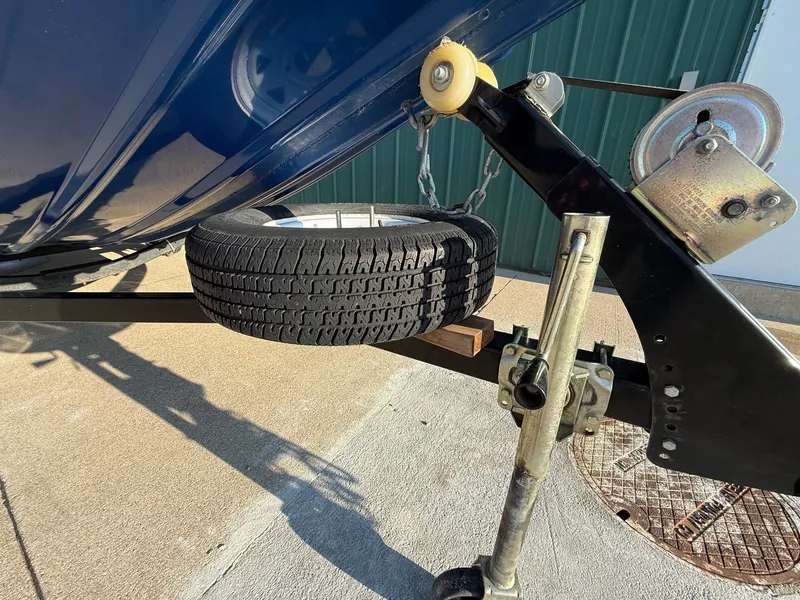 Slide: The Image of 2009 Alumacraft Pro 175 boat trailer with spare tire. - 32