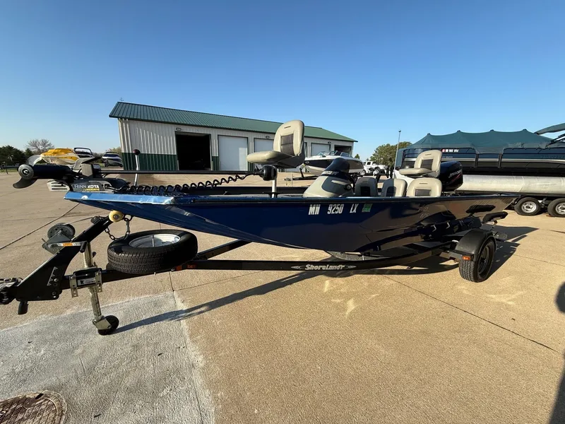 Slide: The Image of 2009 Alumacraft Pro 175 boat on trailer, blue sky. - 4