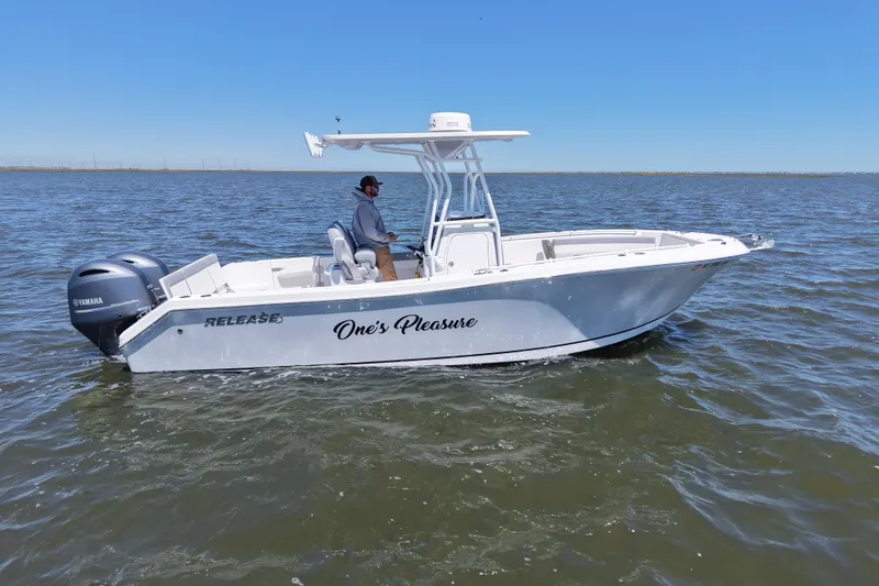 Slide: The Image of 2022 Release 240 RX boat on water, featuring Yamaha engines, clear blue sky. - 12