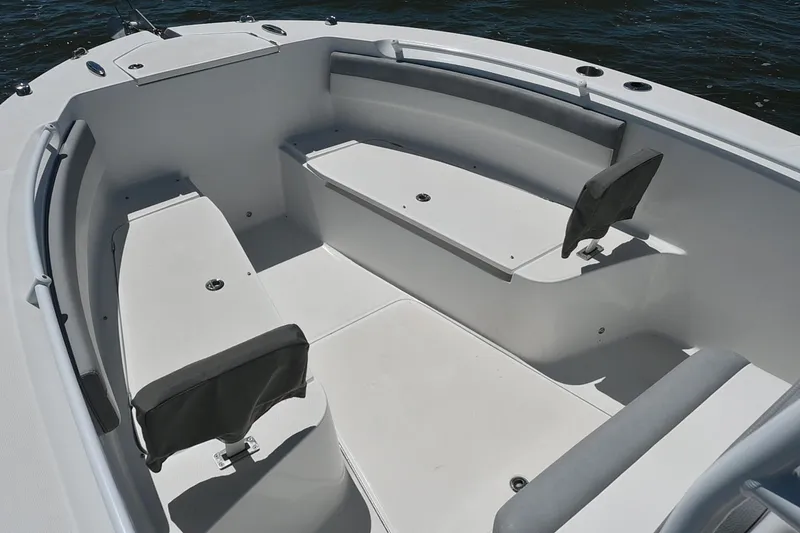 Slide: The Image of 2022 Release 240 RX boat interior with cushioned seating and storage compartments. - 14