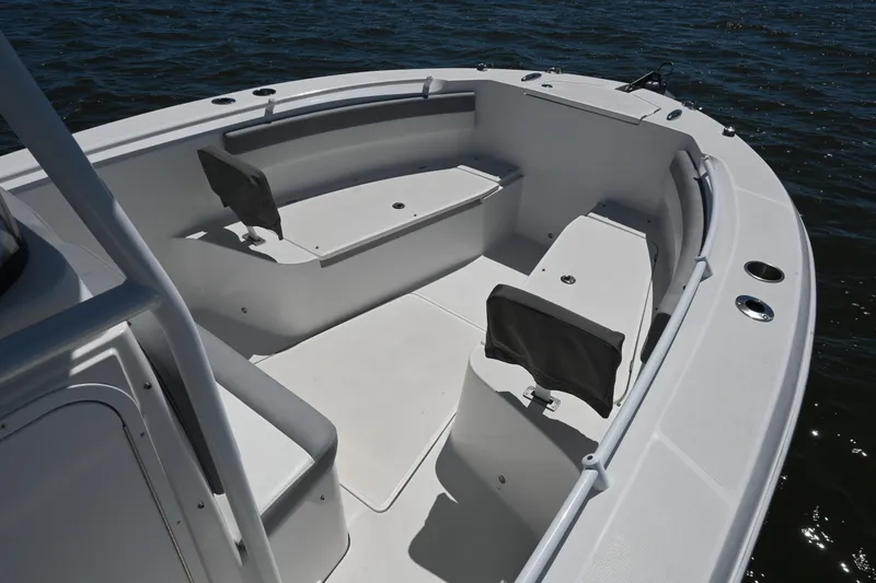 Slide: The Image of 2022 Release 240 RX boat interior with seating, on calm water. - 15