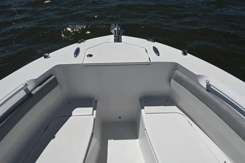 Slide: The Image of Bow seating area of 2022 Release 240 RX boat on water. - 18
