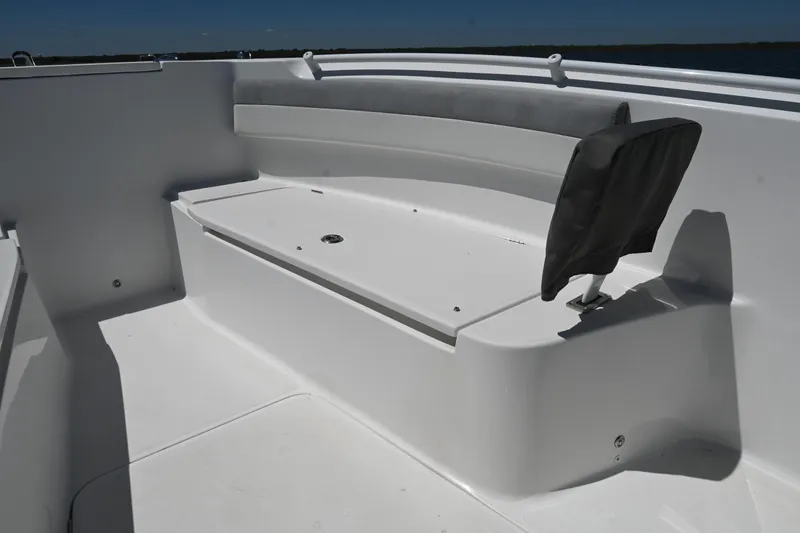 Slide: The Image of 2022 Release 240 RX boat interior with white seating and storage compartment. - 20
