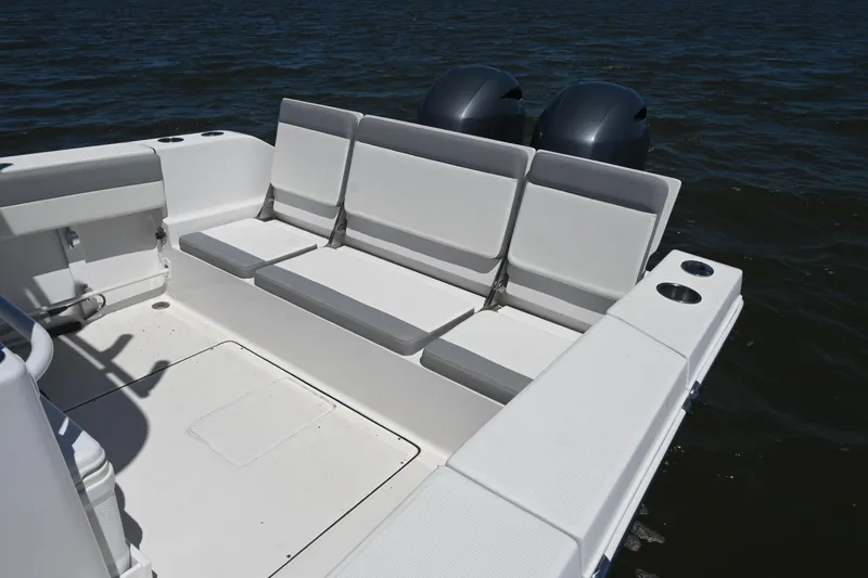 Slide: The Image of 2022 Release 240 RX boat with spacious seating and dual engines on the water. - 21