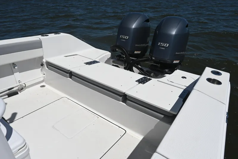 Slide: The Image of 2022 Release 240 RX boat with dual Yamaha 150 engines on open water. - 22