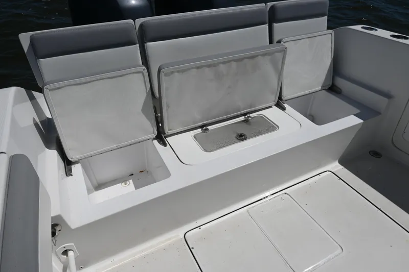 Slide: The Image of 2022 Release 240 RX boat seating with storage compartments, featuring sleek design and functionality. - 25