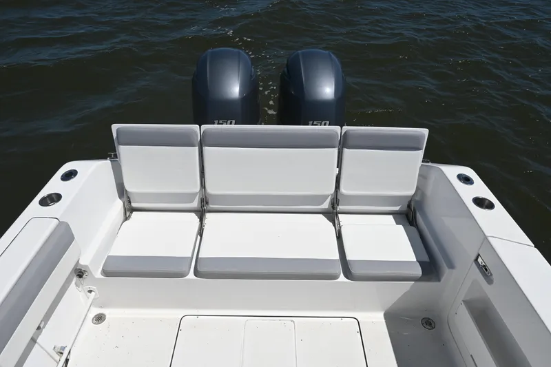 Slide: The Image of 2022 Release 240 RX boat with dual engines and spacious seating on the water. - 26