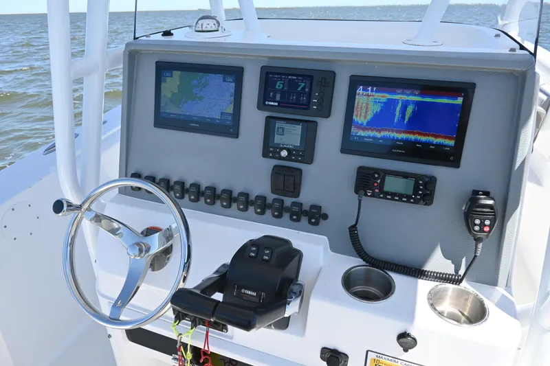 Slide: The Image of Control panel of 2022 Release 240 RX boat with navigation and communication equipment. - 28