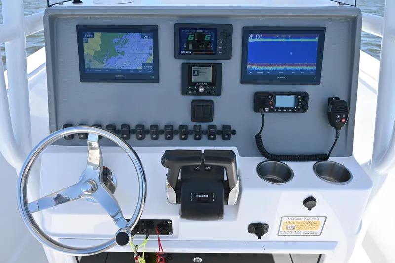 Slide: The Image of Boat dashboard with navigation screens and controls, Release 240 RX, 2022 model. - 29