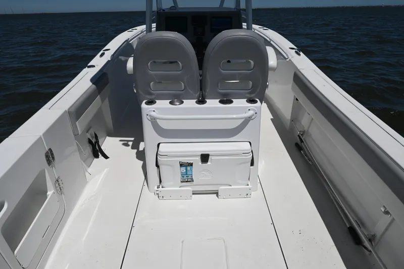 Slide: The Image of 2022 Release 240 RX boat interior with dual seats and ocean view. - 36