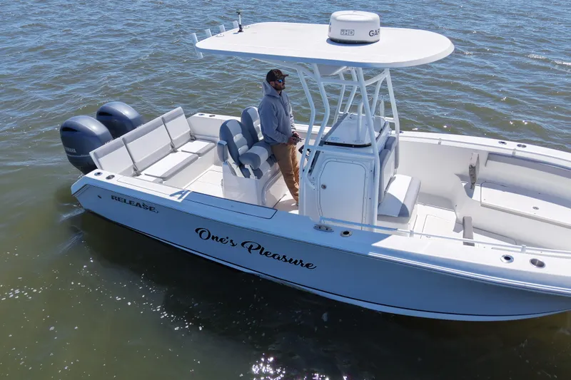 Slide: The Image of 2022 Release 240 RX boat on water, featuring dual engines and sleek design. - 4