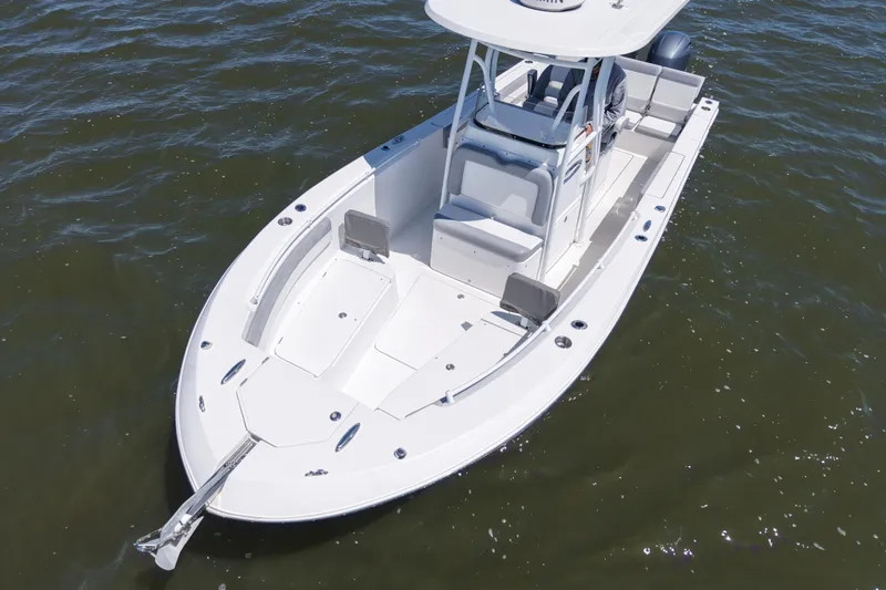 Slide: The Image of 2022 Release 240 RX boat on water, featuring spacious deck and modern design. - 6