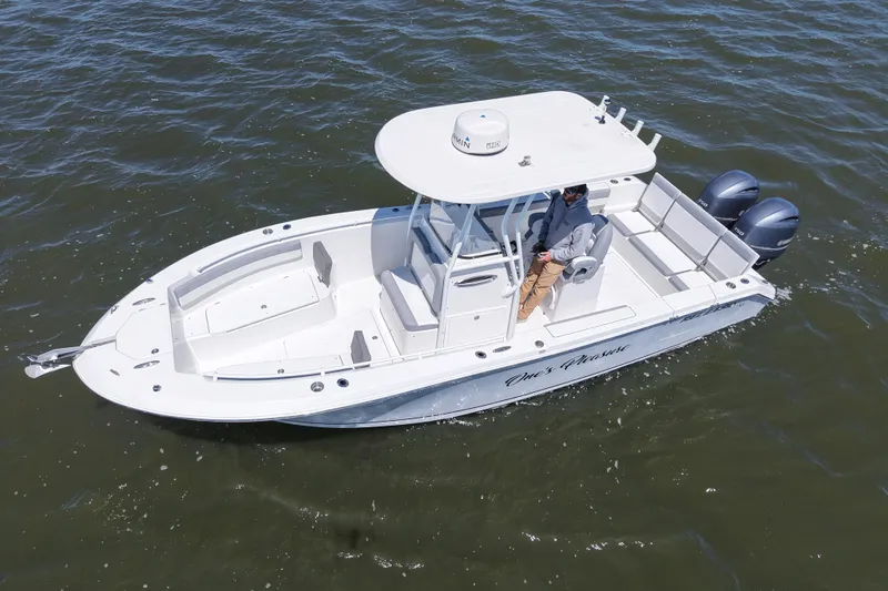 Slide: The Image of 2022 Release 240 RX boat on water, featuring dual engines and spacious deck. - 9