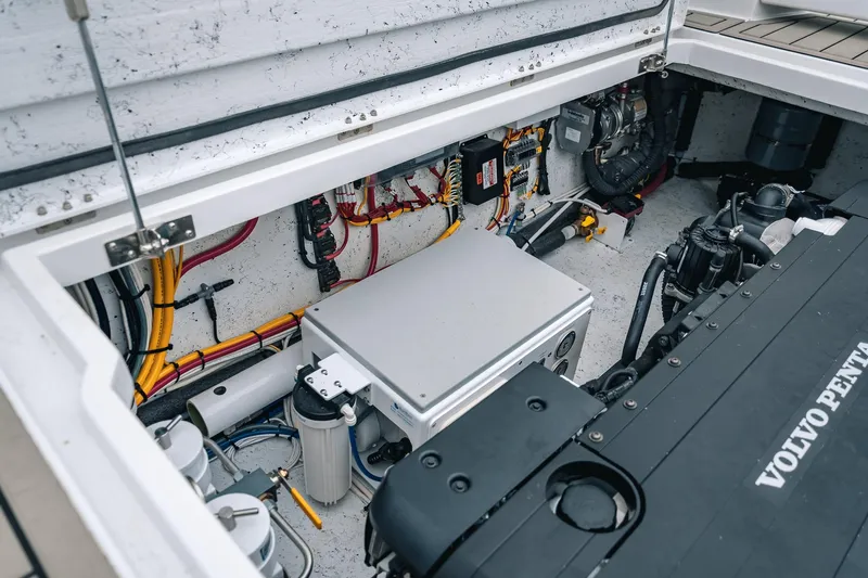 Slide: The Image of Engine compartment of 2024 Lindell 46 boat with Volvo Penta engine and wiring. - 13