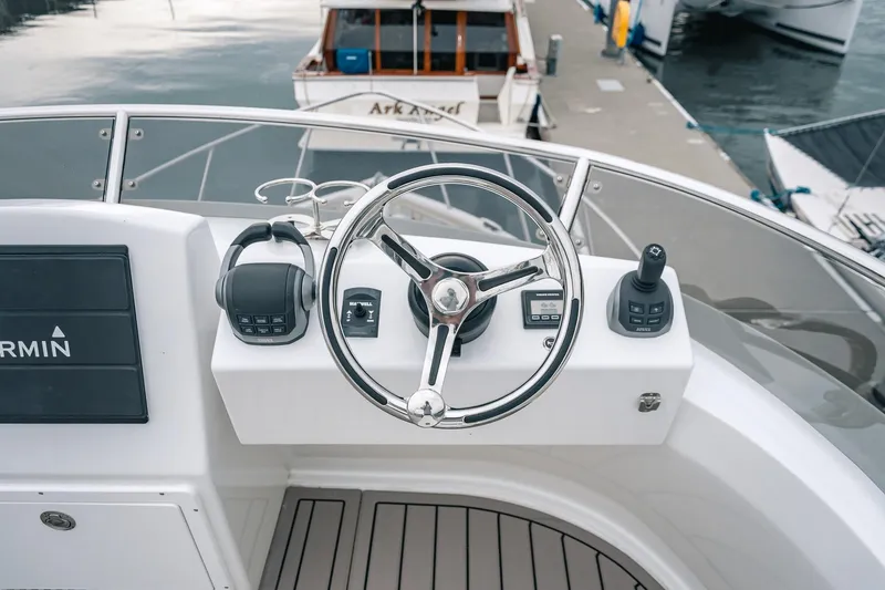 Slide: The Image of Steering console of 2024 Lindell 46 boat with Garmin navigation system. - 16