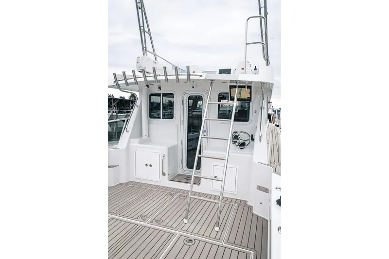 Slide: The Image of 2024 Lindell 46 boat deck with ladder and sleek design. - 27