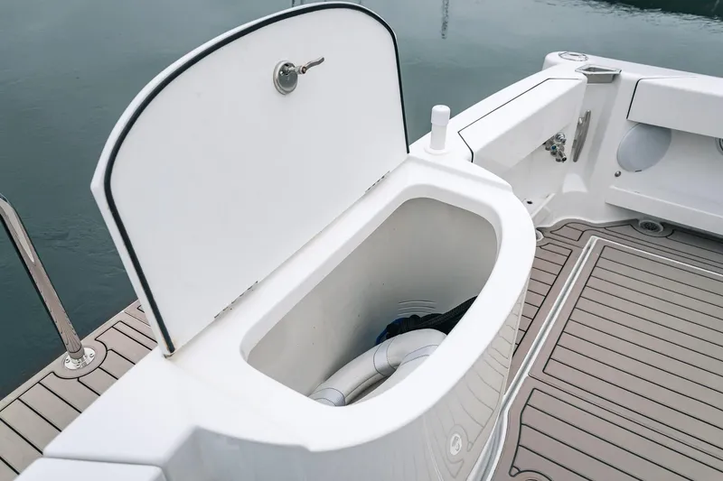 Slide: The Image of Open storage compartment on 2024 Lindell 46 boat, featuring sleek design and spacious interior. - 30