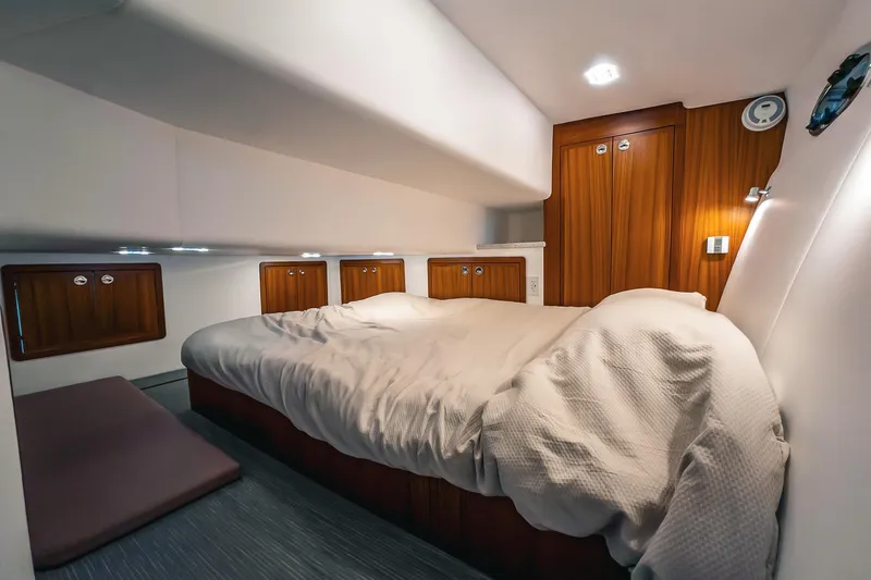 Slide: The Image of Luxurious cabin interior of 2024 Lindell 46 yacht with cozy bedding and wooden accents. - 32