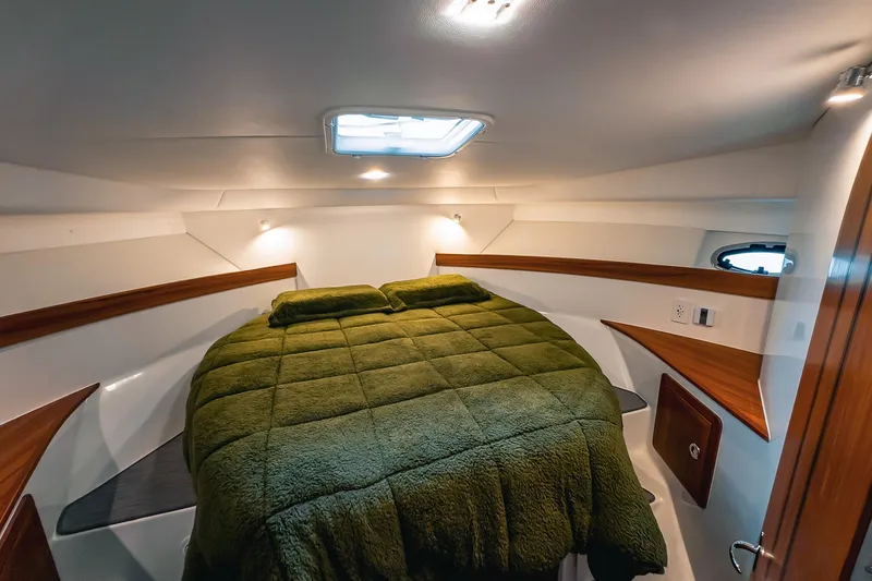 Slide: The Image of Luxurious cabin interior of 2024 Lindell 46 yacht with plush green bedding. - 34