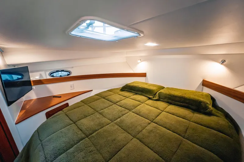 Slide: The Image of Luxurious cabin interior of 2024 Lindell 46 yacht with cozy bed and TV. - 35