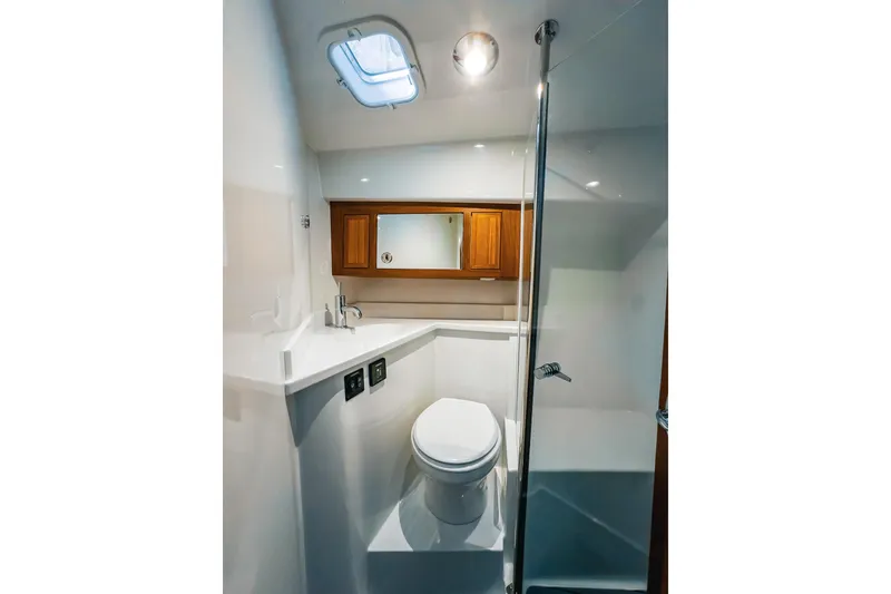 Slide: The Image of Modern bathroom in 2024 Lindell 46 yacht with sleek design and wooden cabinetry. - 41
