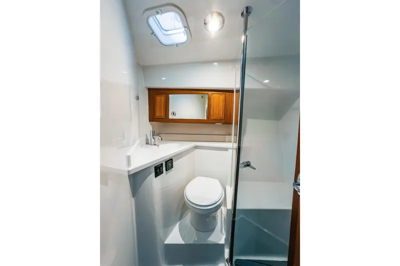 Slide: The Image of Modern bathroom in 2024 Lindell 46 yacht with sleek design and wooden cabinetry. - 42