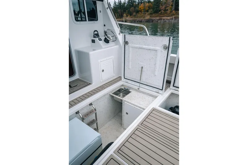 Slide: The Image of 2024 Lindell 46 boat interior with open storage compartments and sleek design. - 5
