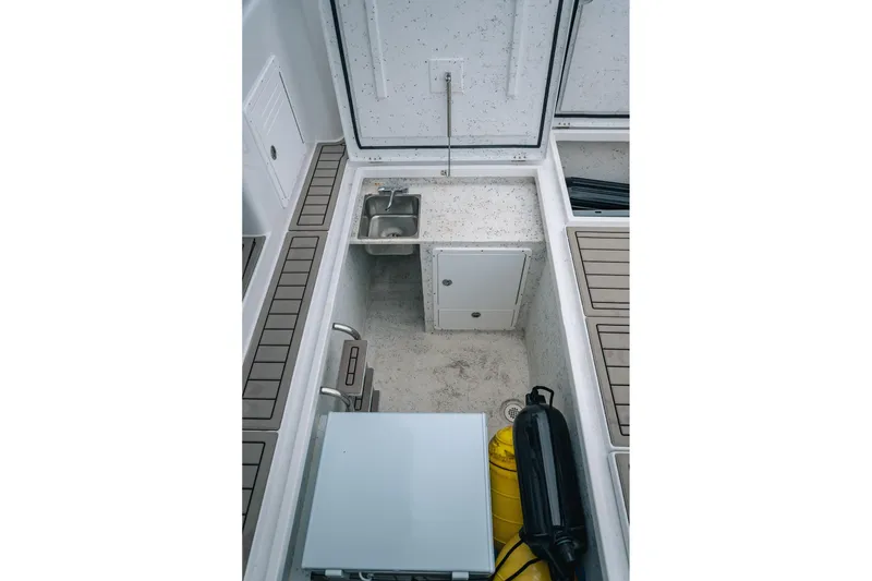Slide: The Image of 2024 Lindell 46 boat interior with sink, storage, and equipment. - 6